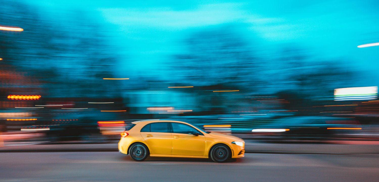 slow shutter speed car moving with background blur
